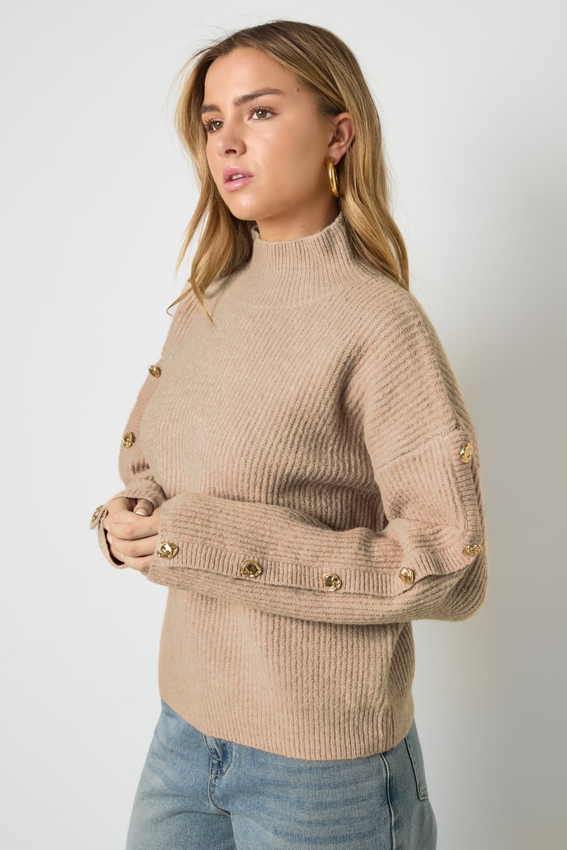 Sweater with buttons on the sleeves