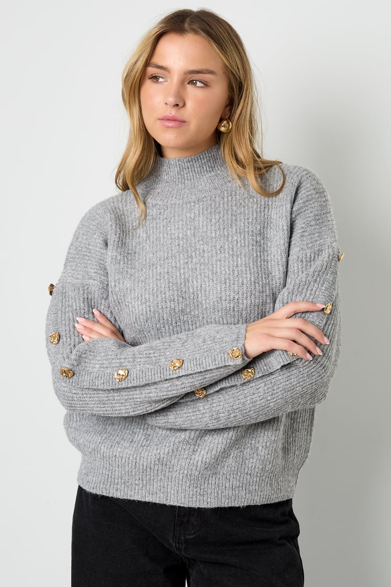 Sweater with buttons on the sleeves